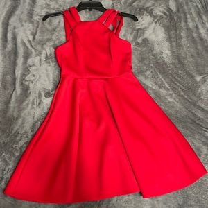 This is a red Junior size 3/4.